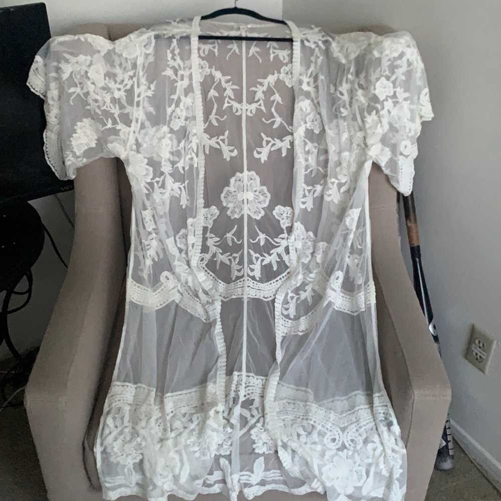 White duster with floral detail